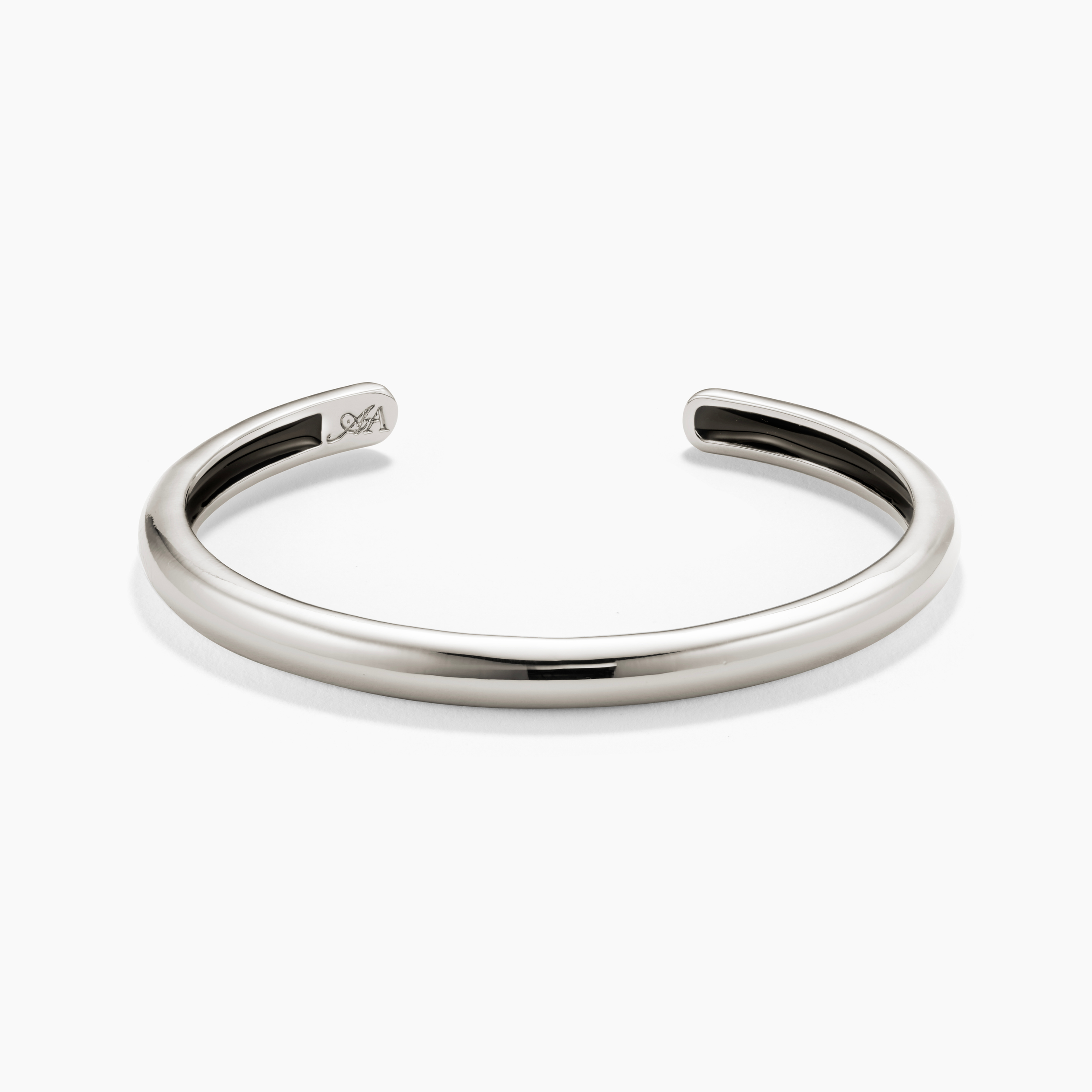 Silver bangle on a white background