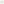        Gold hoop earrings on a light gray background