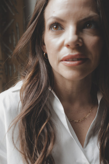 Woman wearing a white shirt with a blurred background
