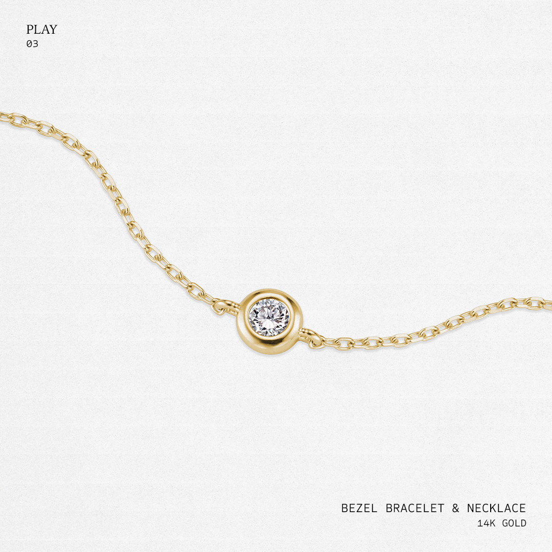 Gold bezel bracelet and necklace on a white background