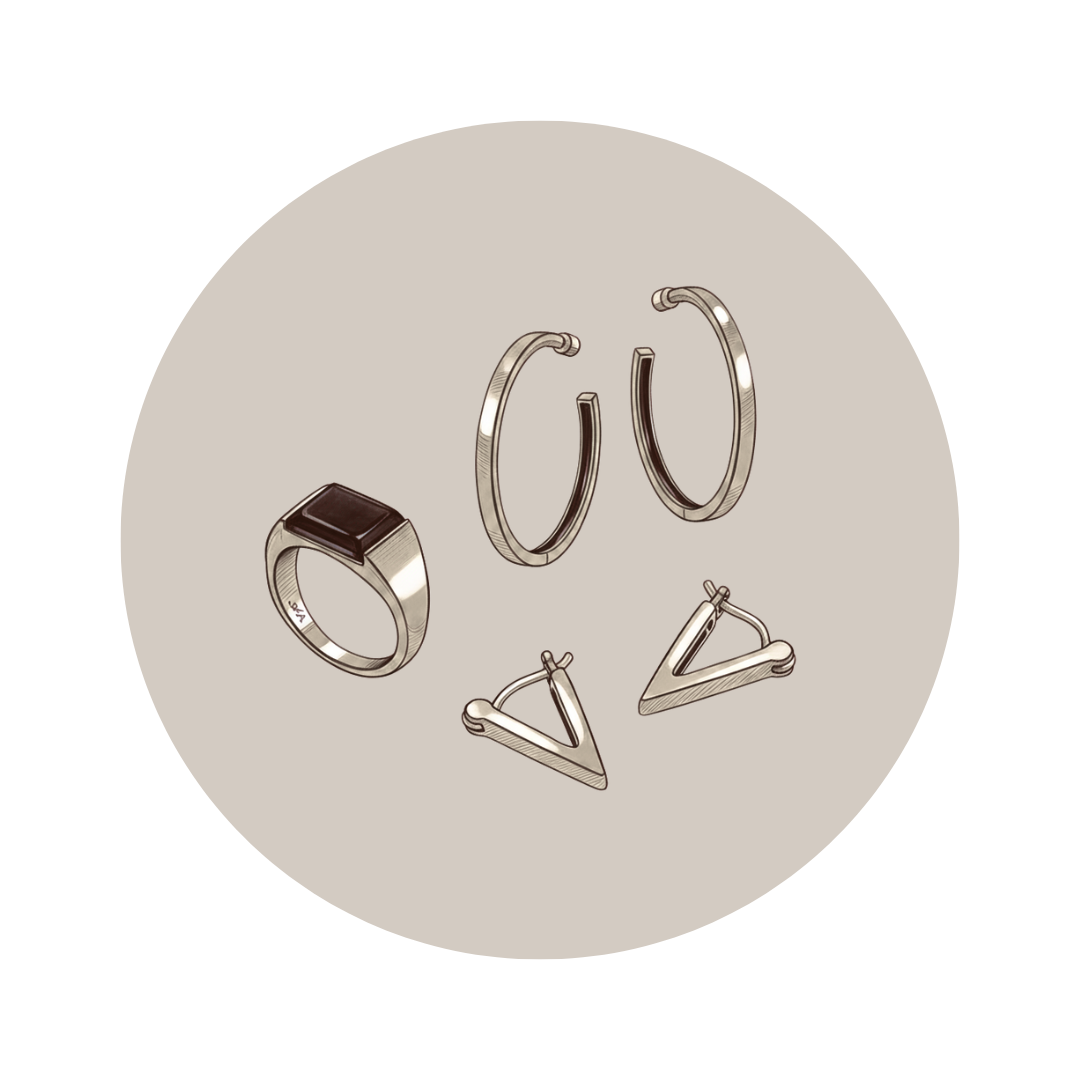 Set of silver rings on a beige circular background