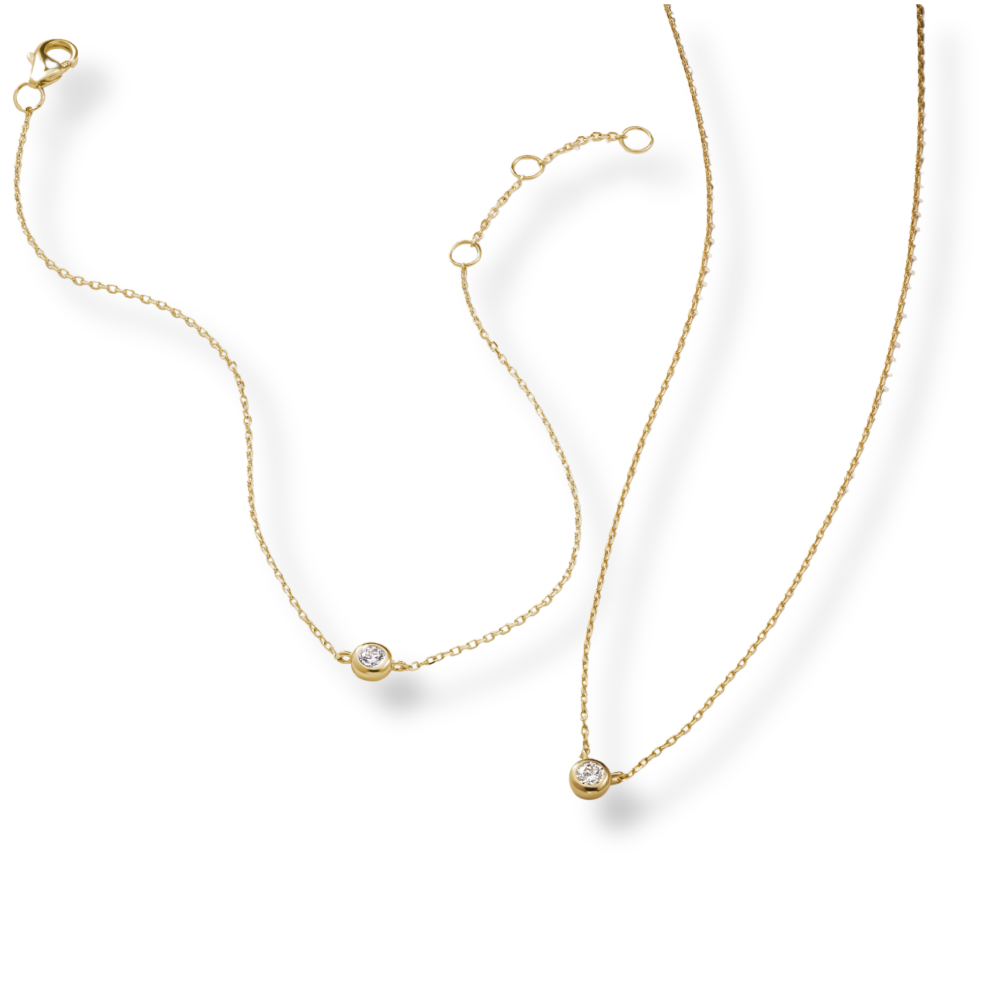 Armine and Ambrose Diamond Bezel Gold Necklace and Bracelet on white background 