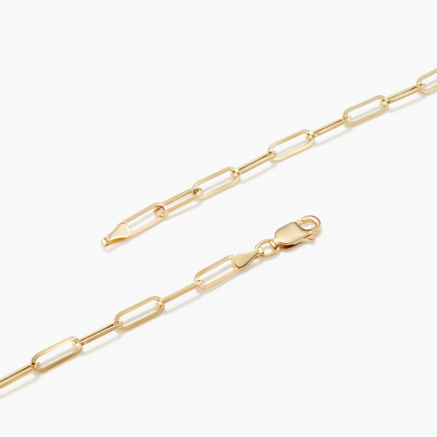Gold chain necklace on a white background