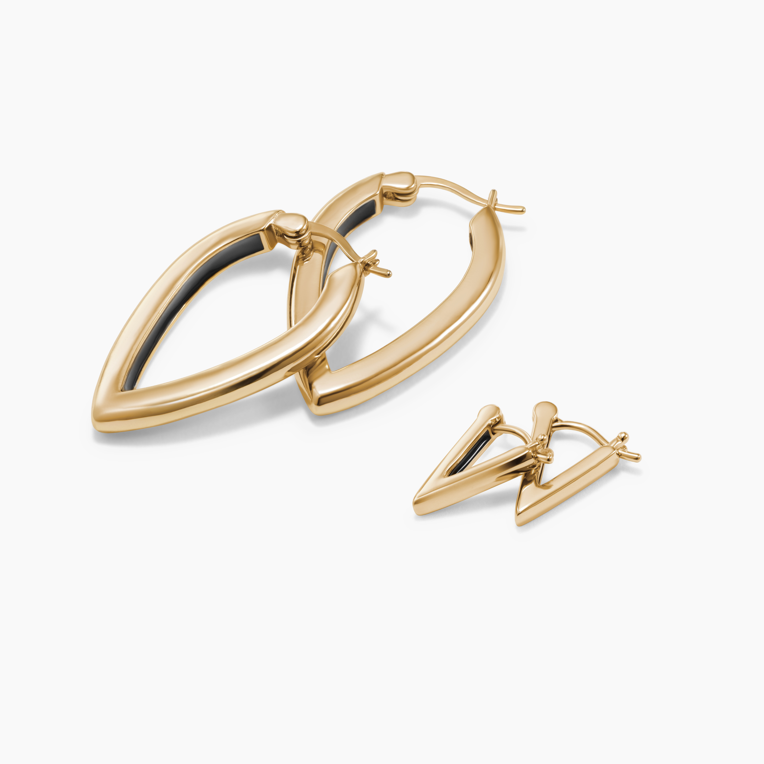 Armine + Ambrose The A Earring Set with inverted-A gold huggies and hoops on a white background