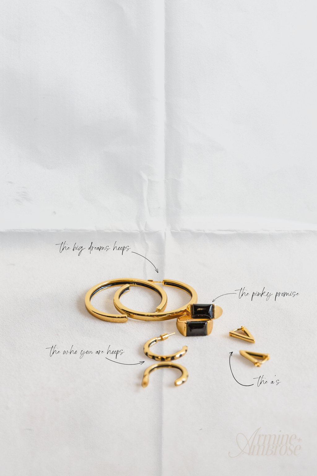 Gold rings with black stones on a white background
